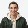 Person wearing a green jacket with a blurred background