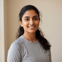 Woman wearing a gray shirt against a plain background